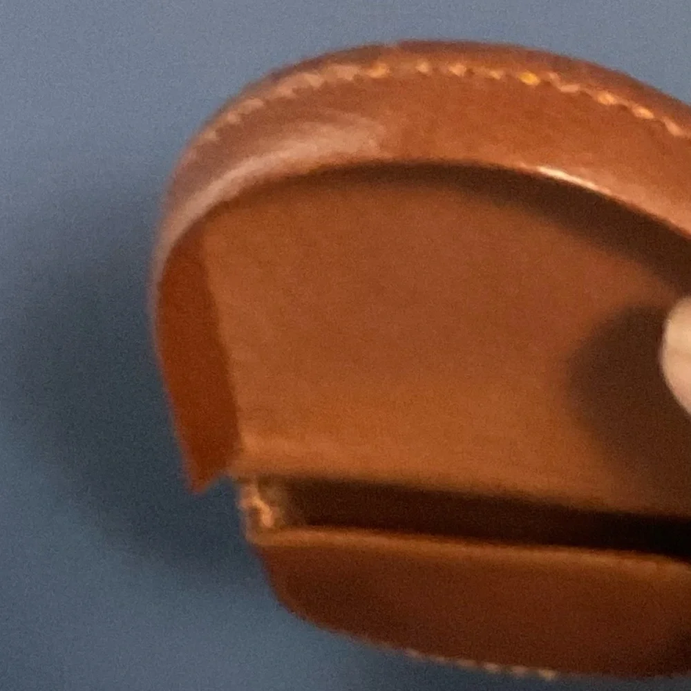 Handcrafted tan leather coin purse horseshoe shape for easy access to change